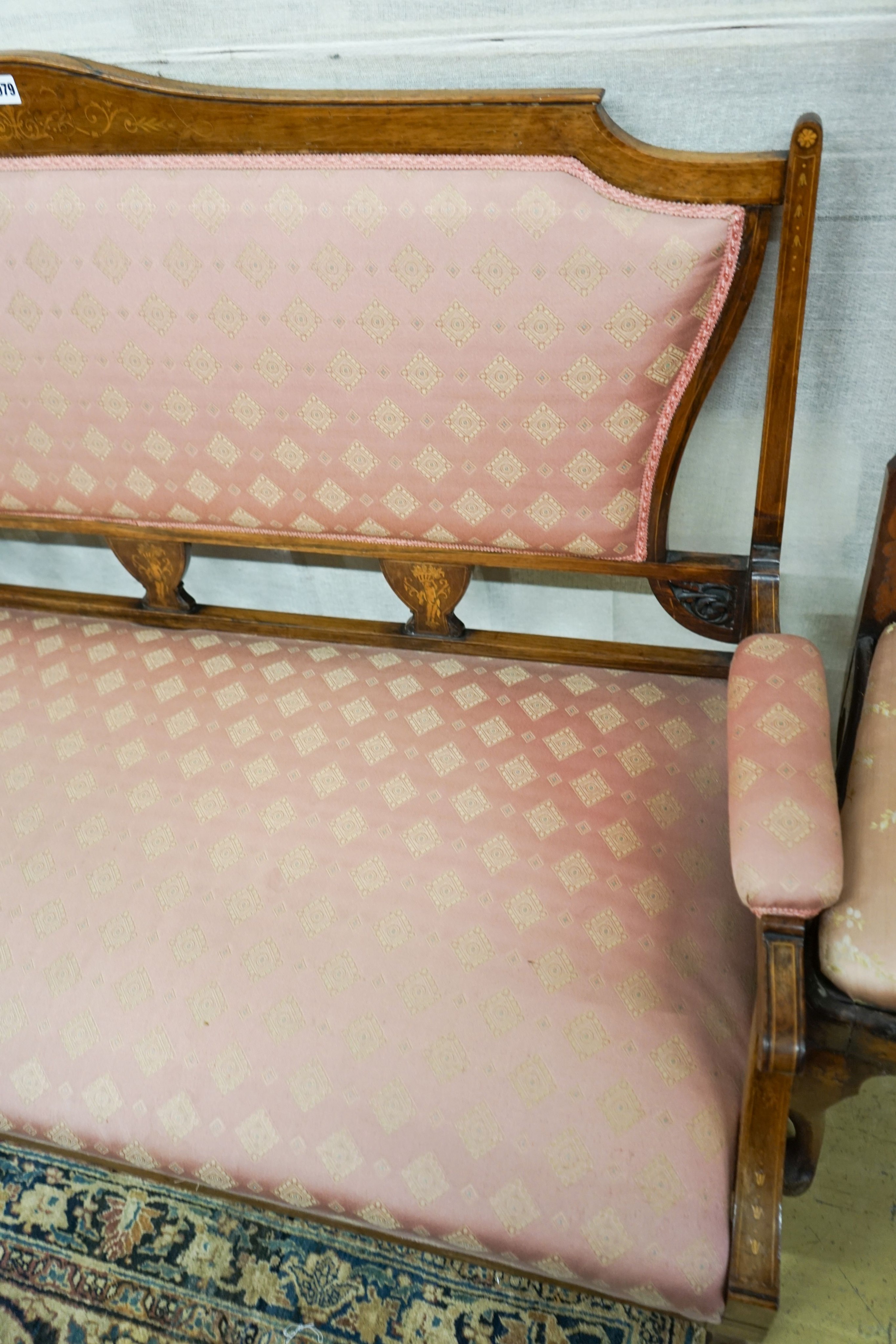 A late Victorian marquetry inlaid rosewood salon settee, length 144cm, depth 60cm, height 90cm